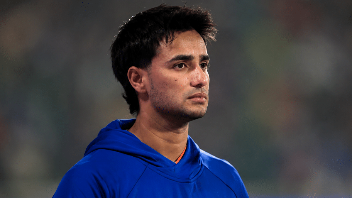Abhishek Sharma in blue training hoodie during a T20I match with focused expression