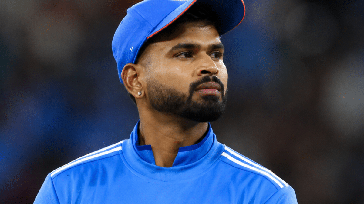 Ultra-realistic side-profile portrait of Shreyas Iyer in the India cricket jersey, captured in a stadium with a softly blurred background.