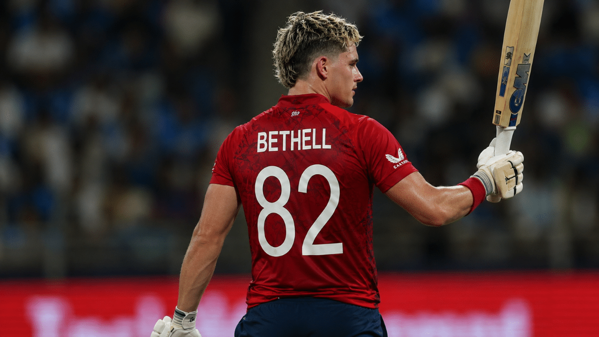 Ultra-realistic rear side-angle portrait of England batter Jacob Bethell raising his bat during an international cricket match.