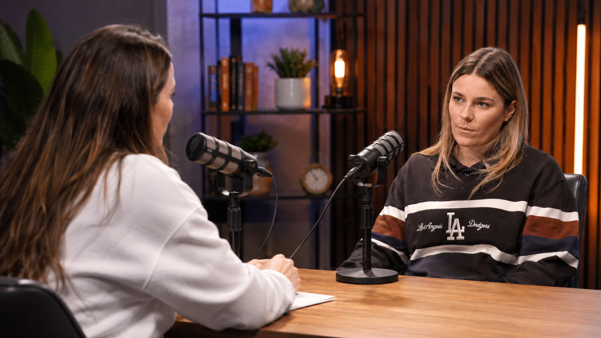 Professional podcast interview featuring two women in a modern studio with microphones