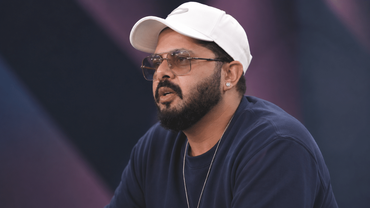 Ultra-realistic close-up portrait of a Sreesanth in a white cap and glasses, photographed from a side angle with shallow depth of field and a clean blurred background.