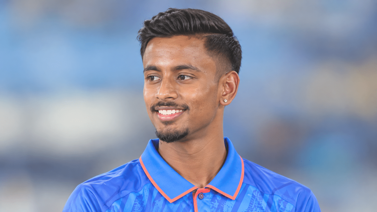 Abishek Porel, Indian left-handed wicketkeeper-batter, wearing a blue cricket jersey