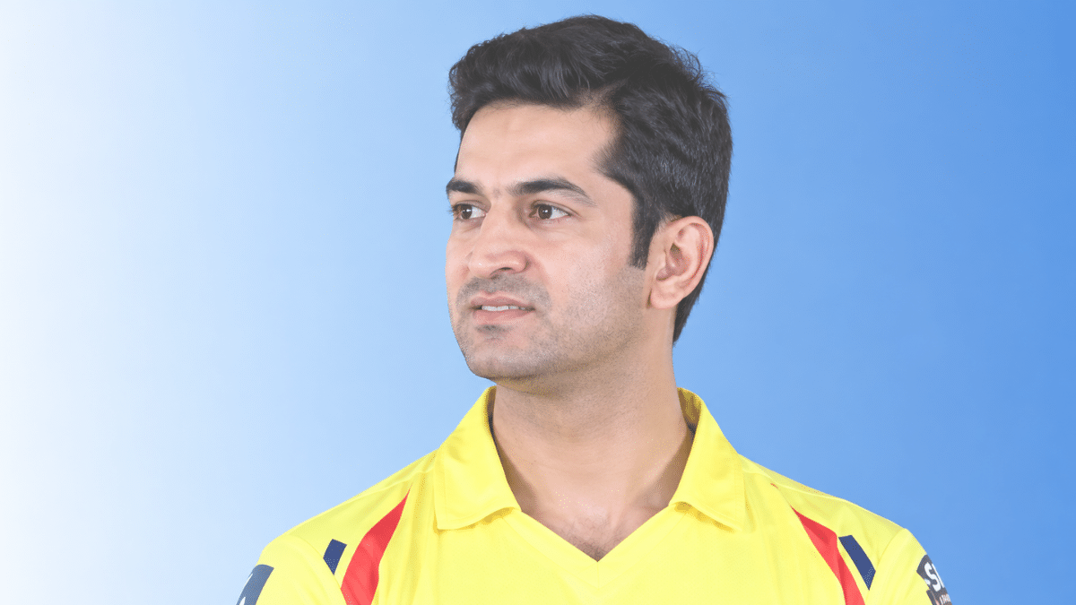 Mohit Sharma, former Indian fast bowler, wearing a yellow cricket jersey and looking to the left.