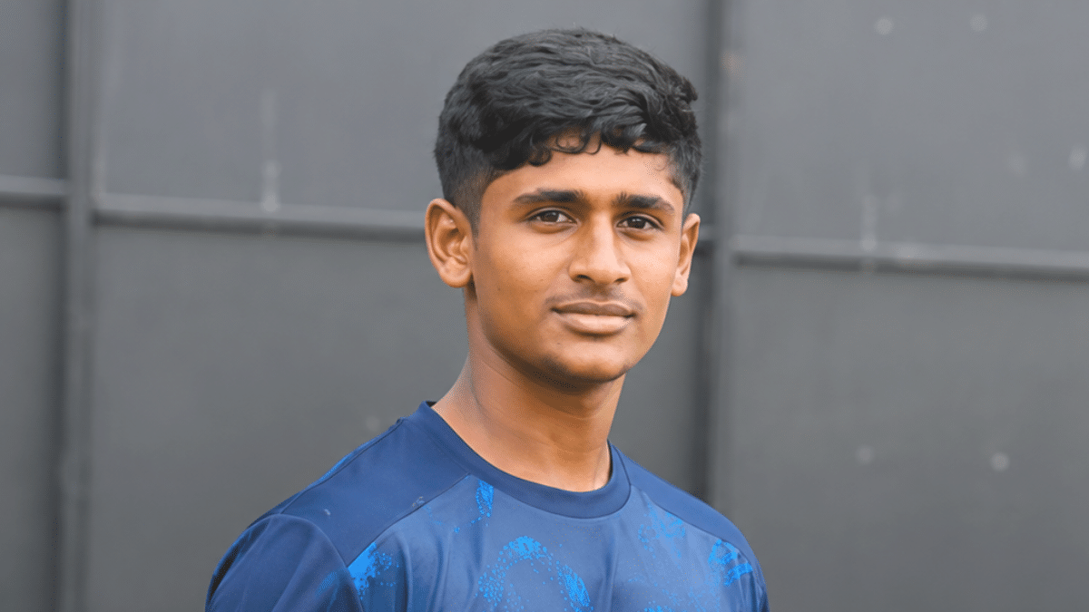 Pranav Ragavendra in a cricket jersey posing at a slight angle