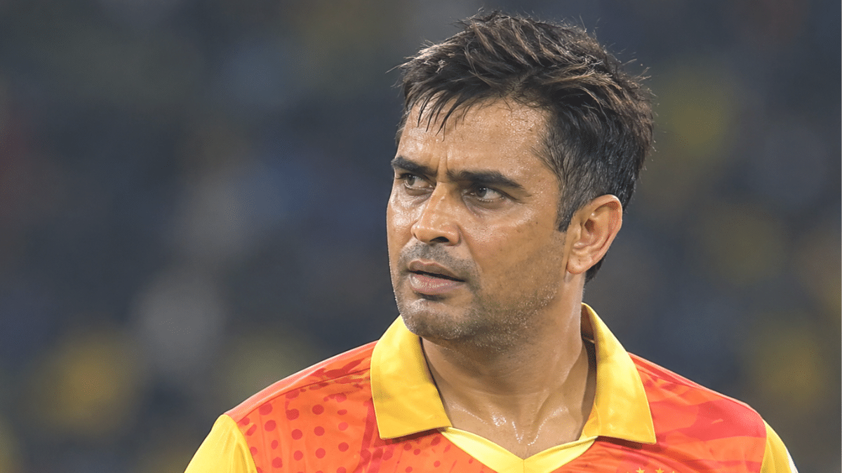 Rajat Bhatia, former Indian domestic cricketer and right-arm medium-fast bowling all-rounder, wearing an orange and yellow cricket jersey.