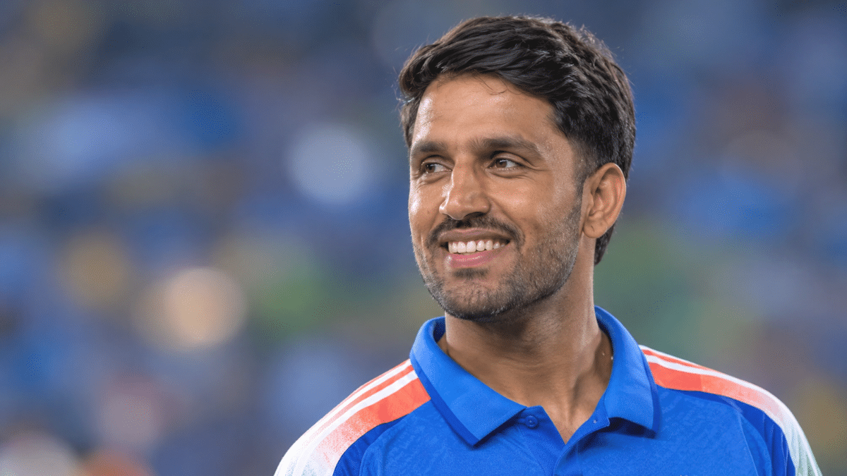 Dhruv Jurel, Indian wicketkeeper-batter, wearing a blue cricket jersey.