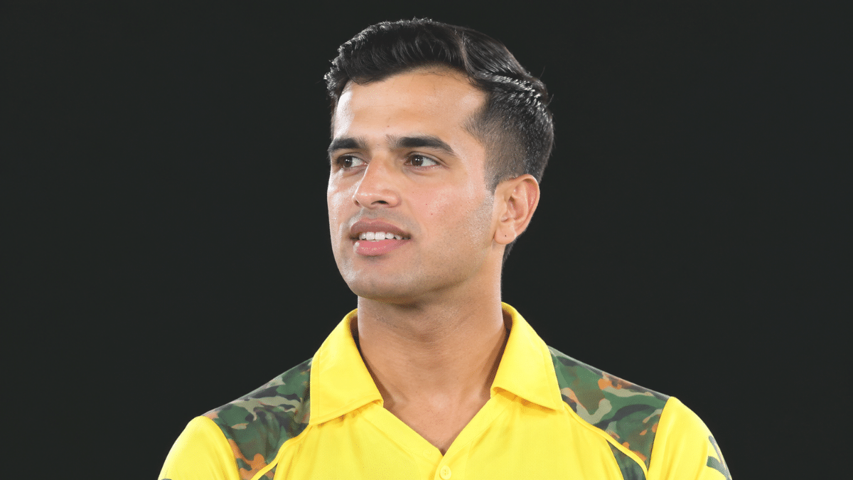 Vansh Bedi in a yellow cricket jersey.