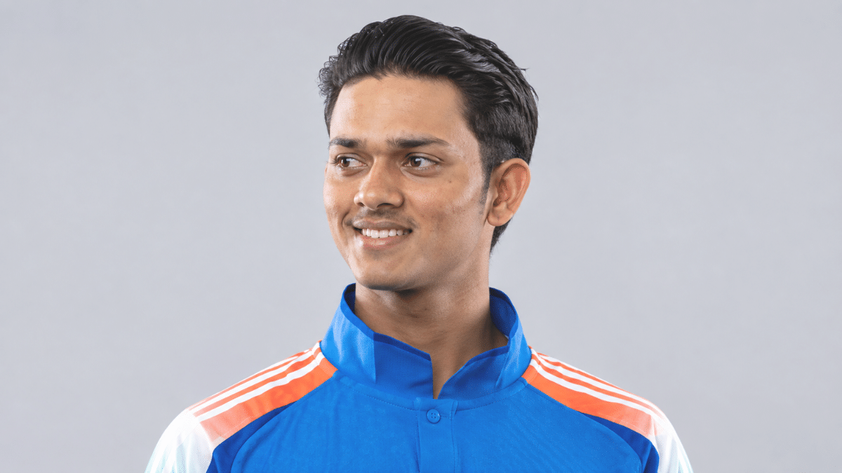 Yashasvi Jaiswal, Indian left-handed batter, smiling in a blue cricket jersey.