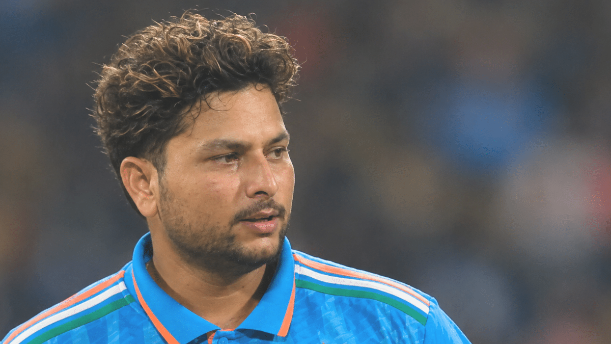 Kuldeep Yadav, Indian left-arm wrist-spinner, wearing a blue cricket jersey and looking to the right.