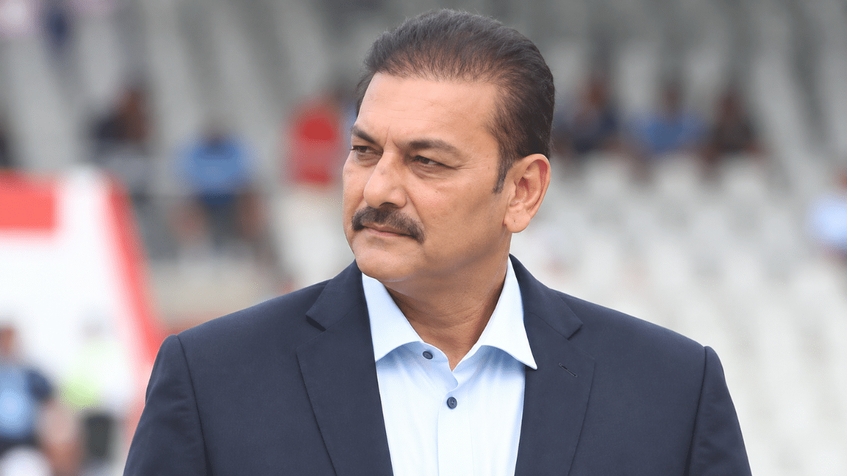 Ravi Shastri, former Indian all-rounder and India head coach, wearing a navy blazer over a light blue shirt and looking to the side.