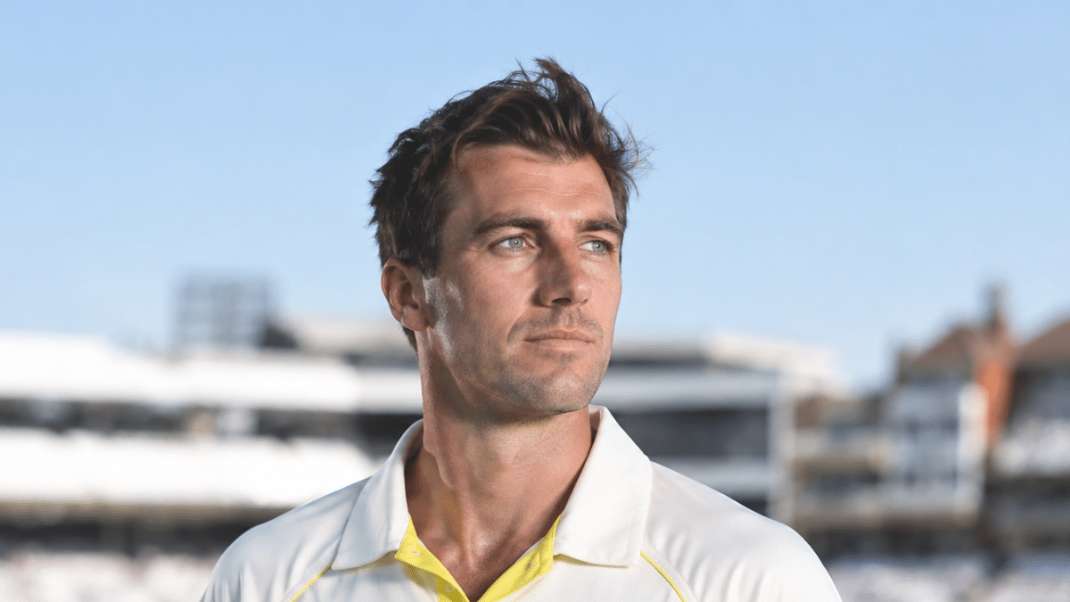 Pat Cummins, Australian fast bowler, wearing a white cricket shirt with yellow trim and looking to the right against a blurred cricket stadium background.
